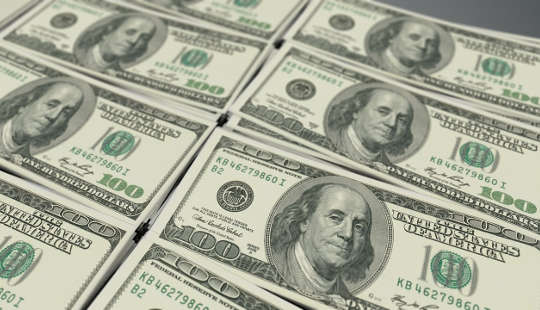 The Story of Our Nation’s Business Success and Wealth stacks of US one-hundred dollar bills