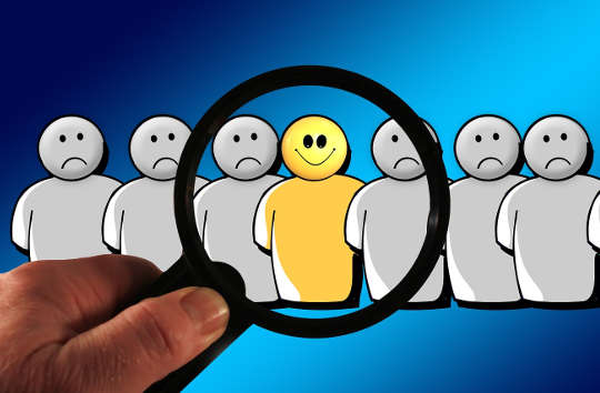 Today's Inspiration: December 19, 2022 a series of figures -- one with a smiling face, all others gloomy