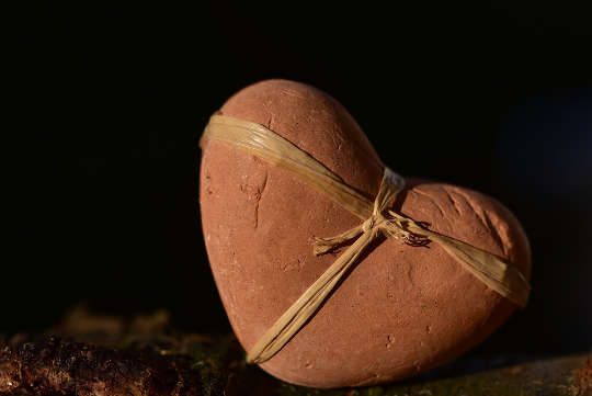 Today's Inspiration: December 20, 2022 a heart made of stone with a ribbon around it