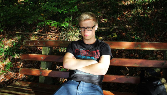 So You Know What's Wrong… Then What? a very frustrated young man sitting on a bench with his arms crossed.
