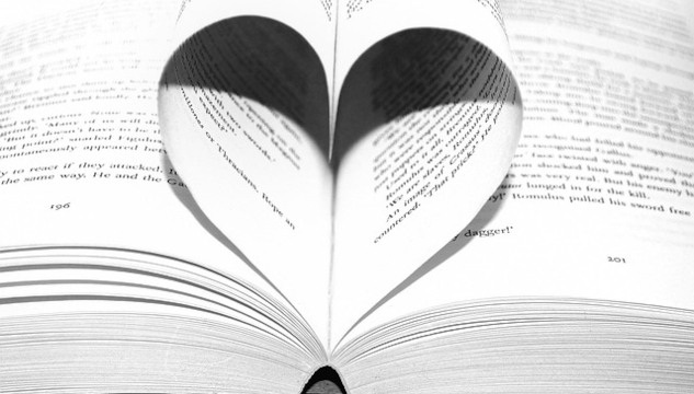 Open book with two pages curled up to form a heart shape. Image by PublicDomainPictures from Pixabay.&nbsp;